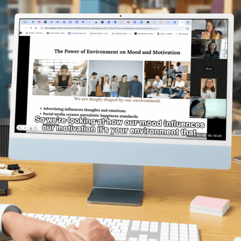 A picture of a monitor with a live session with Allegra Lite and global community with slides on 'The power of mind on motivation"